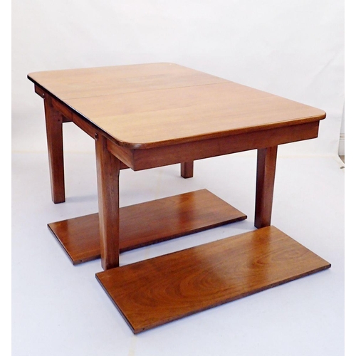 971 - A mahogany extending dining table by Wilkinsons (BFD) Ltd on square tapered supports, with two inter... 