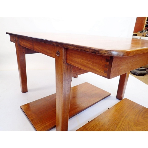 971 - A mahogany extending dining table by Wilkinsons (BFD) Ltd on square tapered supports, with two inter... 