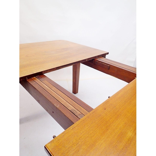 971 - A mahogany extending dining table by Wilkinsons (BFD) Ltd on square tapered supports, with two inter... 