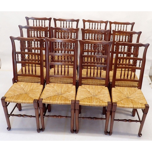 972 - A set of twelve rush seated ladder back country style dining chairs