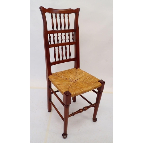 972 - A set of twelve rush seated ladder back country style dining chairs