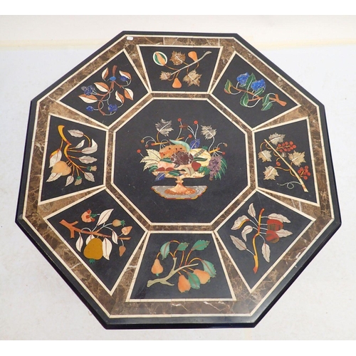 973 - A 20th century pietra dura octagonal table top decorated fruit on a black ground, 76cm diameter