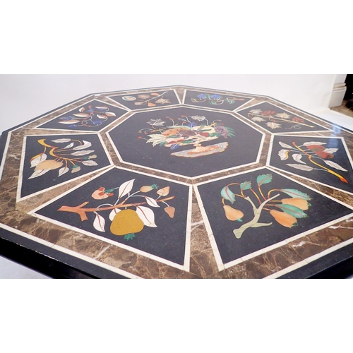 973 - A 20th century pietra dura octagonal table top decorated fruit on a black ground, 76cm diameter