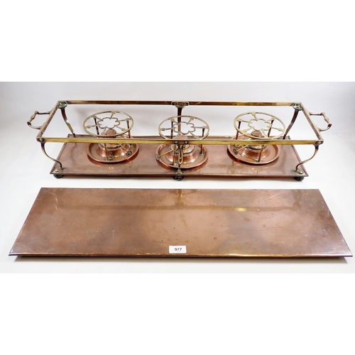 977 - An Edwardian copper and brass hot plate with three spirit burners