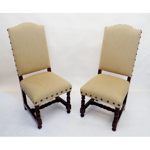 993 - A pair of early 20th century upholstered high back hall chairs on turned supports