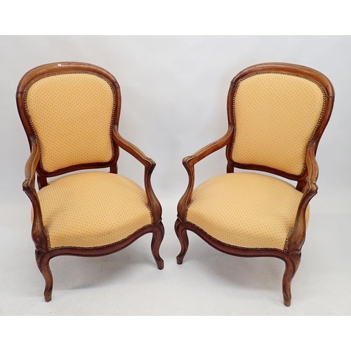 994 - A pair of late 19th century French mahogany framed armchairs with carved supports and upholstered in... 