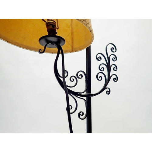 995 - A wrought iron table lamp, 105cm tall