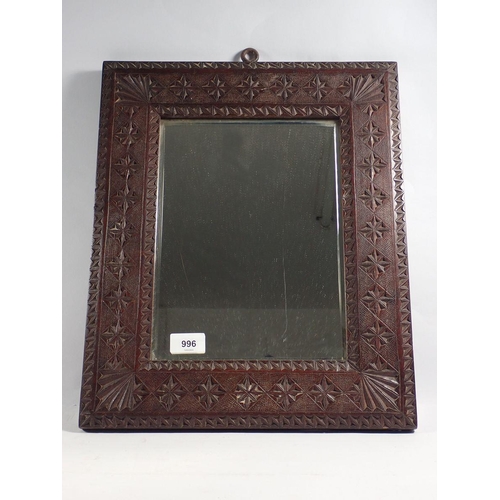 996 - An Eastern carved framed mirror, 44 x 36.5cm