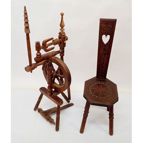 1043 - A spinning wheel and carved spinning chair