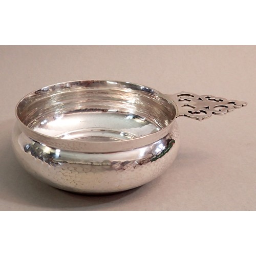 241 - An Arts & Crafts silver bleeding bowl with pieced handle, Birmingham 1909 by A E Jones, 264g, bowl 1... 