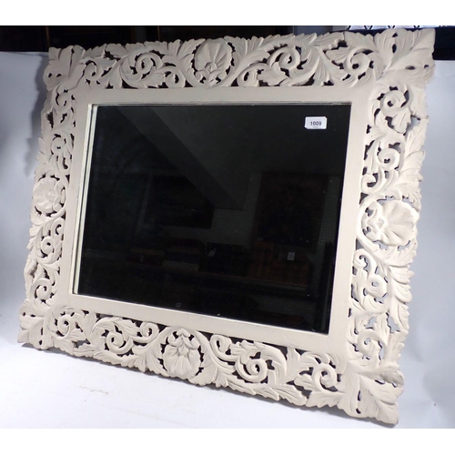 1009 - A white painted foliate framed modern mirror, 68 x 74cm