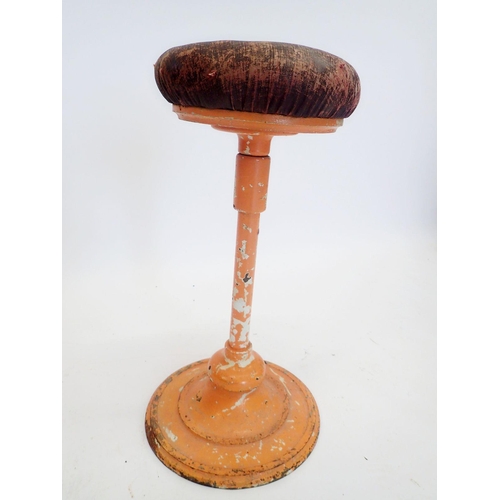 1010 - A French early 20th century dentists stool with swivel seat on metal stem with flexible ball joint t... 