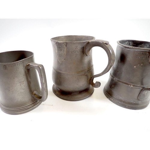 1026 - A group of antique pewter including mugs and tankards