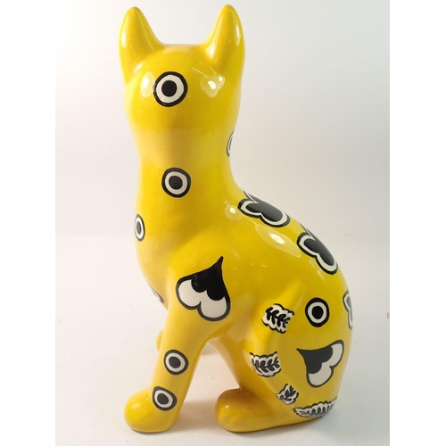 104 - A Griselda Hill Wemyss cat decorated hearts and spots on a yellow ground, 33.5cm