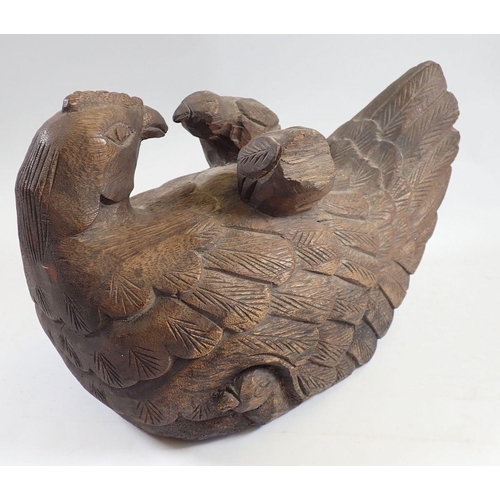 1056 - A large carved wood chicken and chicks, 32cm long