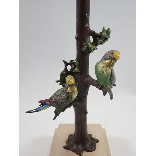 1060 - A 19th century cold painted spelter table lamp in the form of budgerigars on a tree trunk, on alabas... 