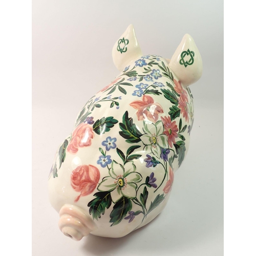 107 - A Griselda Hill Wemyss large pig painted flowers, 38cm long