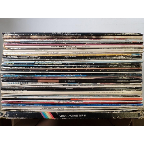 1071 - A group of vinyl records mainly 1980s pop - Depeche Mode, Duran Duran, UB40 etc.