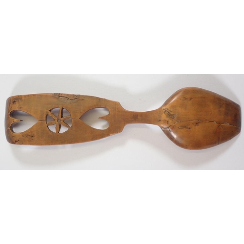 1083 - A late 18th century/early 19th century Welsh love spoon carved hearts and flowers, 18.5cm