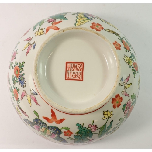 128 - A 20th century Chinese Canton bowl painted butterflies and flowers, 26cm diameter