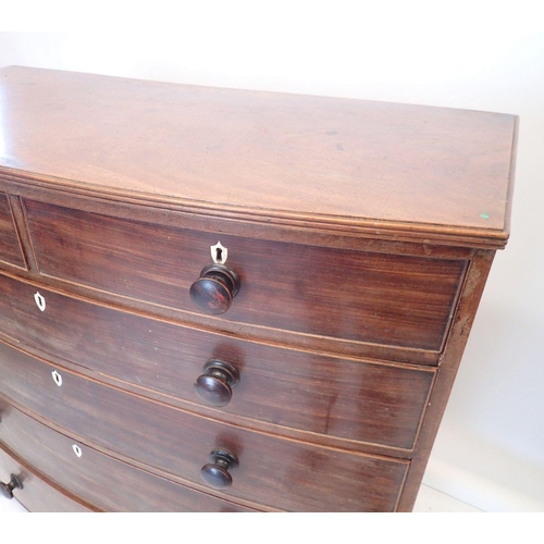 1298 - An early 19th century bow fronted mahogany chest of two short and four long drawers with bone escutc... 