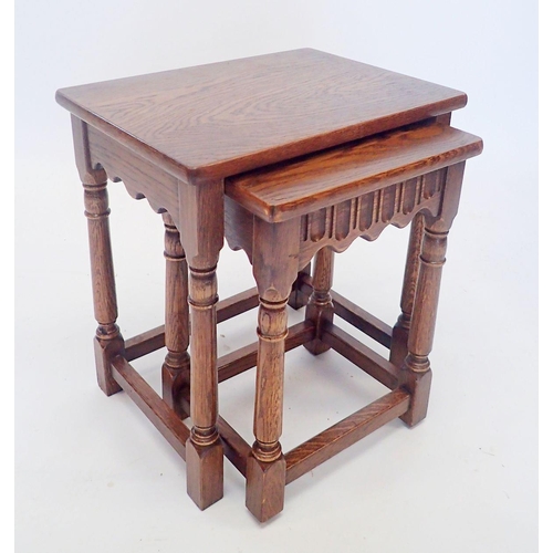 1299 - A nest of two oak occasional tables