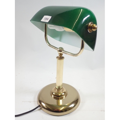 1304 - A brass desk lamp with green shade, 35cm tall