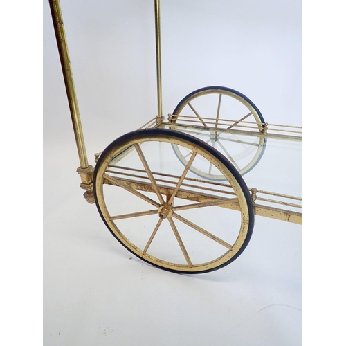 1306 - A vintage brass two tier drinks tea trolley with acorn finials, 90cm long x 79cm high