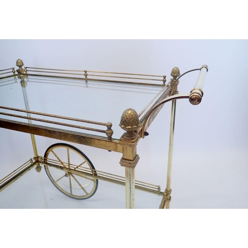 1306 - A vintage brass two tier drinks tea trolley with acorn finials, 90cm long x 79cm high