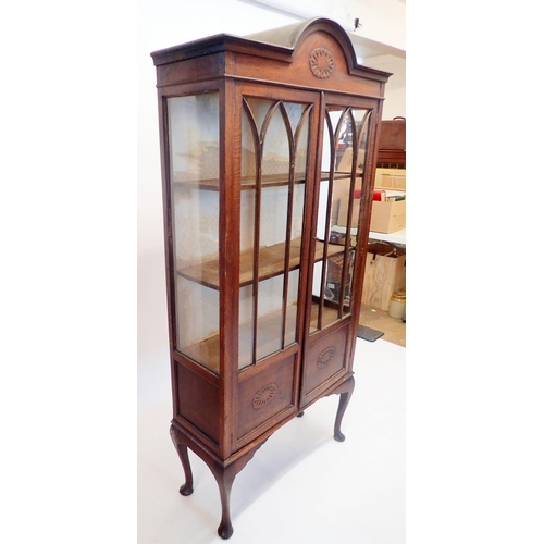 1325 - A 1930's oak two door arch top display cabinet, 183cm high x 88cm wide x 33cm deep