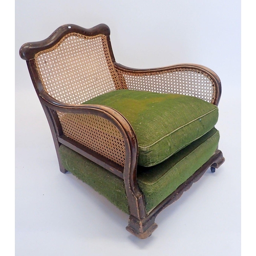 1329 - A Victorian bergere armchair with singe cane back and sides