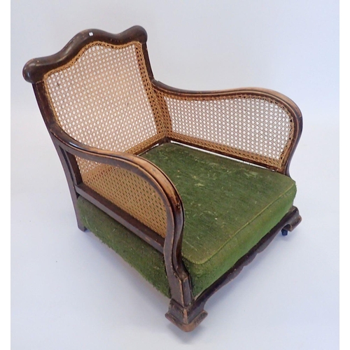 1329 - A Victorian bergere armchair with singe cane back and sides