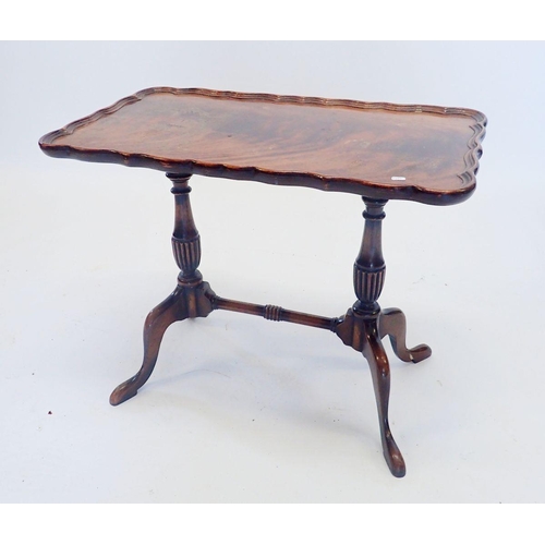 1335 - A walnut occasional table on twin supports, 59 x 34cm