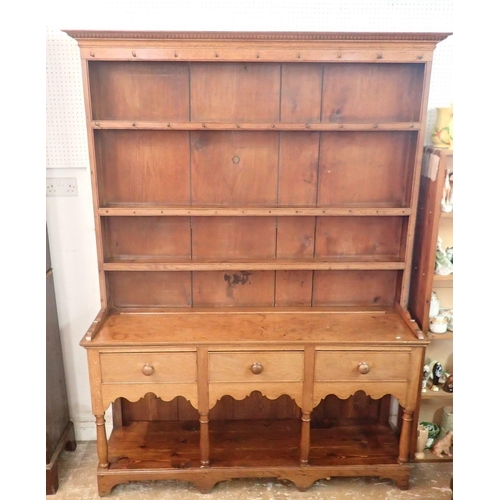 1336 - A 19th century oak and pine Welsh dresser with three tier back over three drawers, shaped apron and ... 