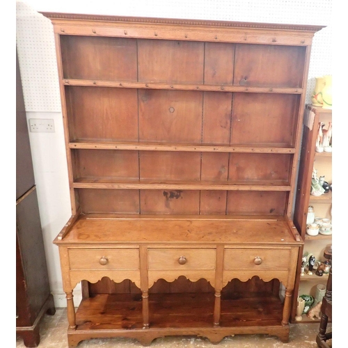 1336 - A 19th century oak and pine Welsh dresser with three tier back over three drawers, shaped apron and ... 