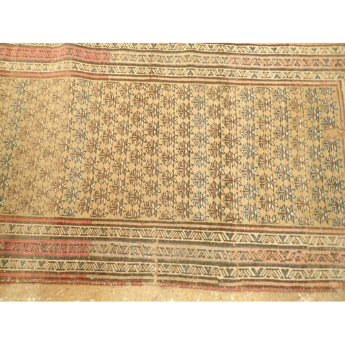 1341 - A Turkish runner with multiple guls on an ochre ground, 390 x 97cm