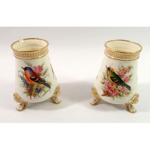 197 - A pair of Royal Worcester vases painted birds in sprays of flowers and berries, by John Hopewell on ... 