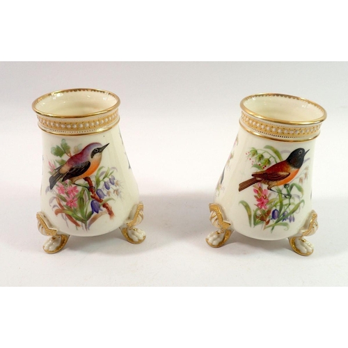 197 - A pair of Royal Worcester vases painted birds in sprays of flowers and berries, by John Hopewell on ... 