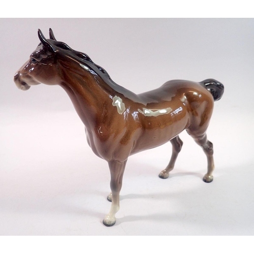 202 - A Beswick brown mare and foal, a Beswick pony and an Italian Donkey, tallest 22cm