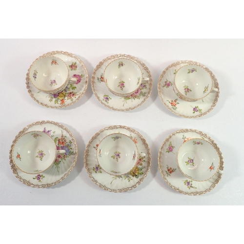 204 - A set of six Dresden floral painted tea cups and saucers