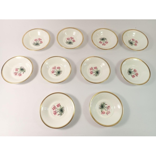 22 - A set of ten Royal Worcester Irish Whisky cups and saucers printed flowers