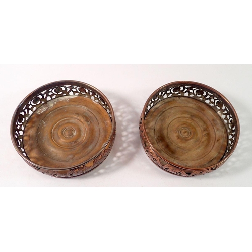 259 - A pair of Georgian silver plate on copper bottle coasters on turned wood bases