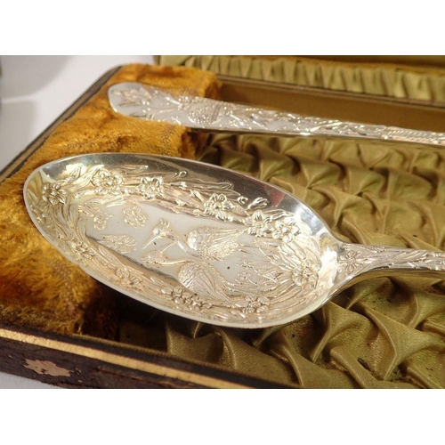 266 - A pair of Victorian silver plated serving spoons in Aesthetic style and another similar pair decorat... 