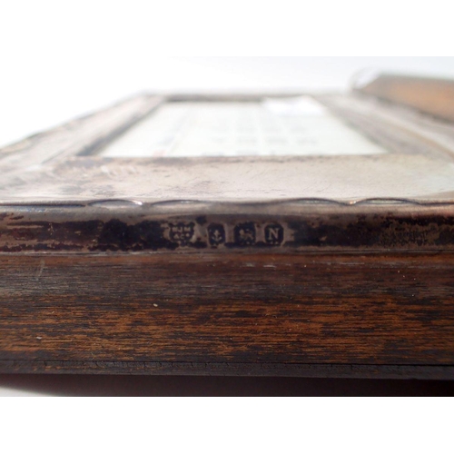 315 - A silver mounted oak desk calendar, Birmingham 1937, 15 x 22cm