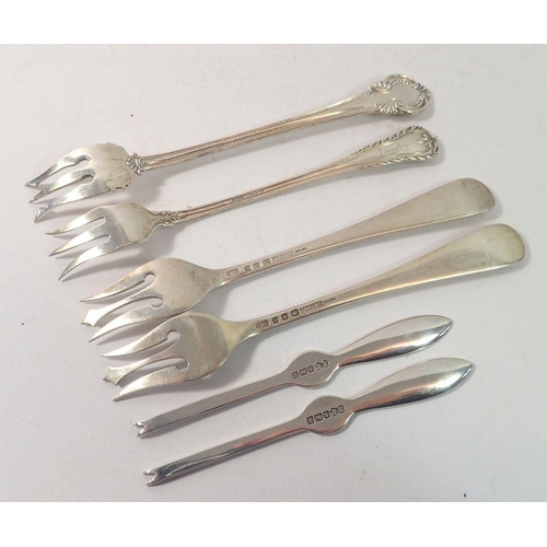 316 - Four various silver seafood forks and two silver small seafood picks, 110g