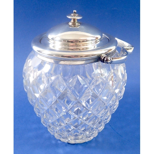 318 - A cut glass a silver mounted biscuit jar with silver lid, Sheffield 1912 by J Round, 18cm tall