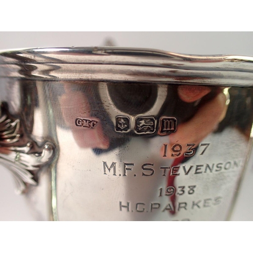 320 - A silver three handled Art Nouveau trophy cup, 'Kingsland Grand Gymnasium Cup', engraved names, Birm... 