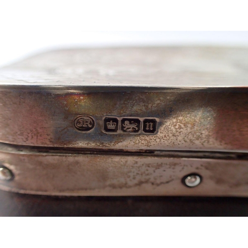 383 - A silver mounted leather toiletry box with engraved scrollwork decoration, Sheffield 1905, 16 x 7cm ... 