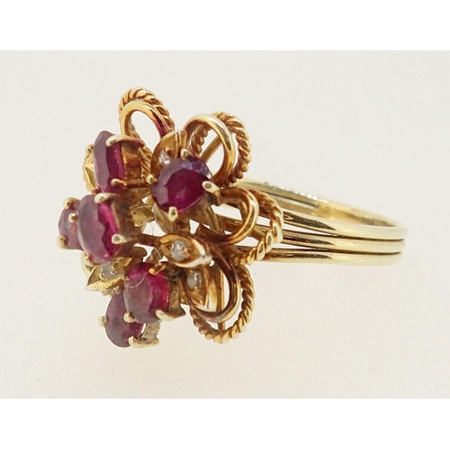 399 - A vintage gold asymmetrical ring set six oval cut rubies and five chip diamonds, size R to S