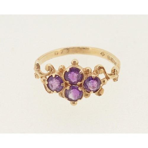 415 - An antique style 9 carat gold ring set four amethysts in scrollwork and beaded surround, 1.6g, size ... 